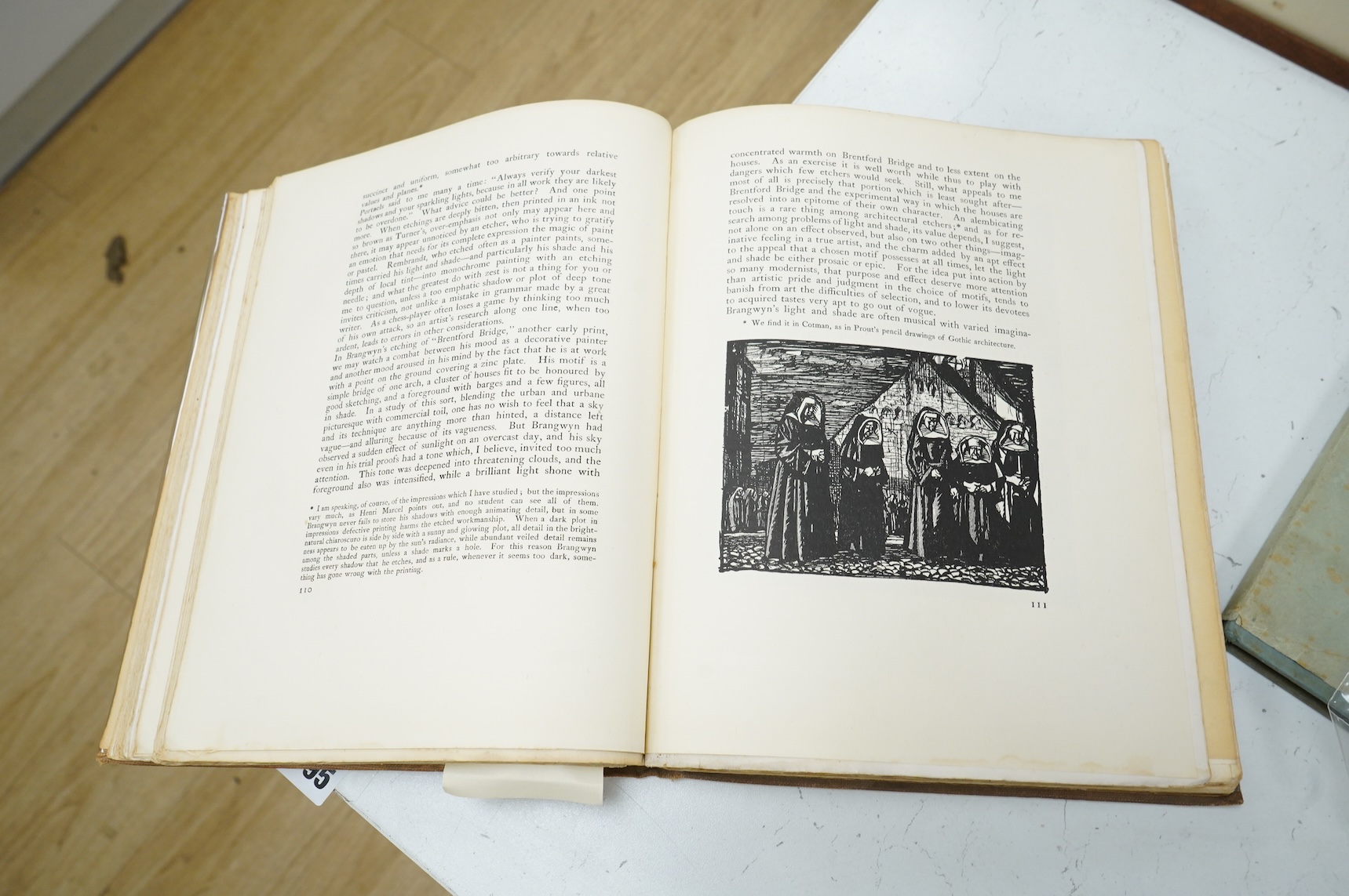 Frank Brangwyn RA RWS RBA (Welsh, 1867-1956), ‘Breaking up the Caledonia’, signed in pencil, lithograph, 28 x 37cm, together with a hardback book, Masters of Etching No.1 Frank Brangwyn and two modern woodcutters booklet